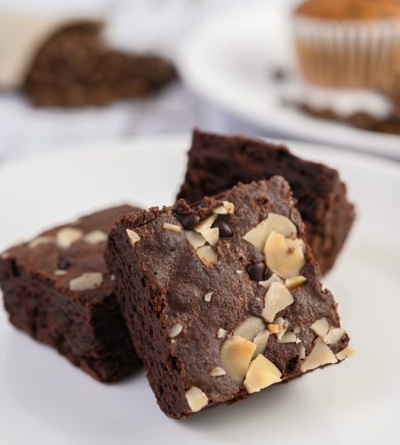 chocolate brownies on a white plate.